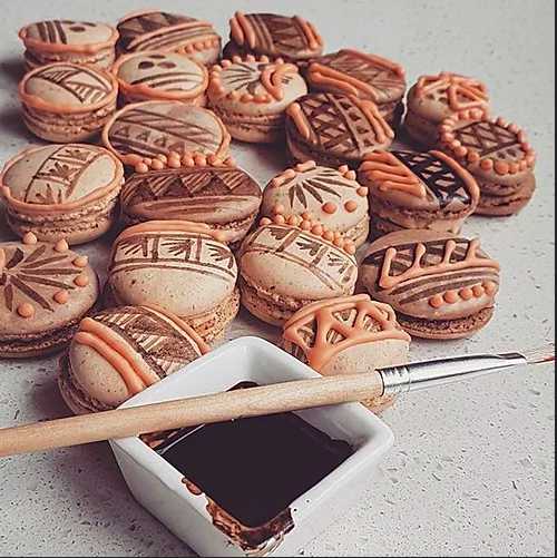 light brown macarons decorated with traditional Fijian designs
