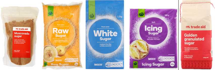Five bags of sugar products. The first bag is Trade Aid Muscovado sugar in a clear bag with a red label. The second bag is Countdown own brand Raw sugar in a yellow orange bag. The third bag is Countdown own brand white sugar in a blue bag. The fourth bag is Countdown own brand icing sugar in a purple bag. The fifth bag is Trade Aid golden granulated sugar in a red and white bag.